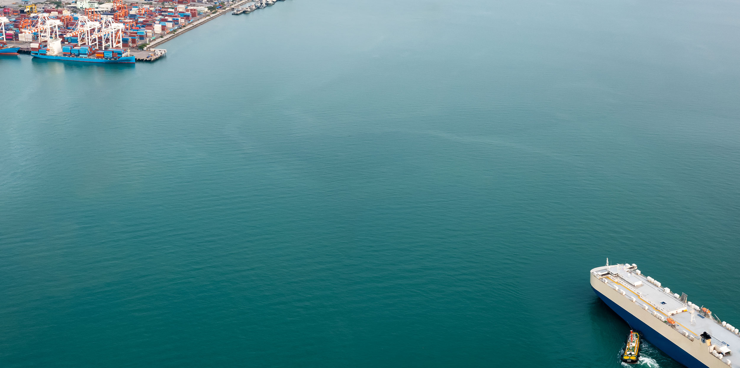 Industrial shipping port with cargo containers and cranes